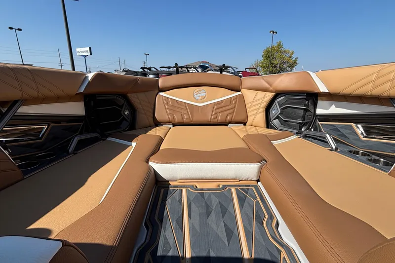Slide: The Image of Luxurious interior of 2025 Tigé Ultré 25ZX boat with tan leather seating. - 46