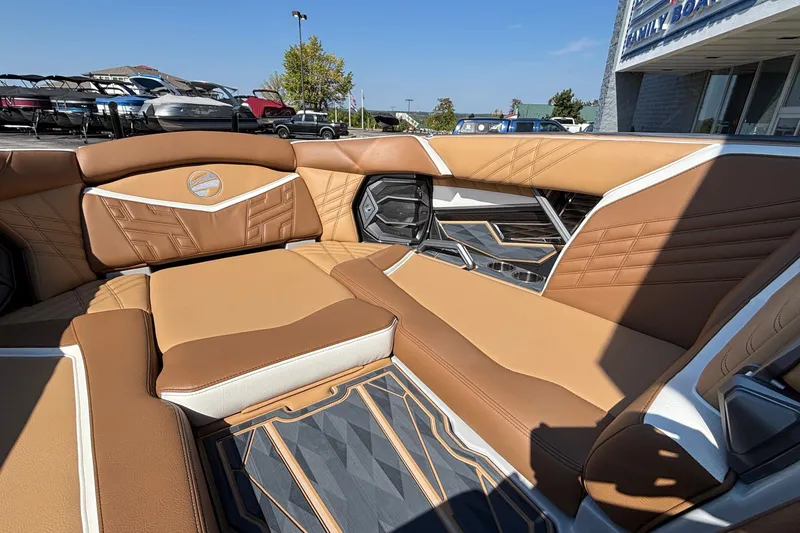 Slide: The Image of Luxurious interior of 2025 Tigé Ultré 25ZX boat with tan leather seating. - 47