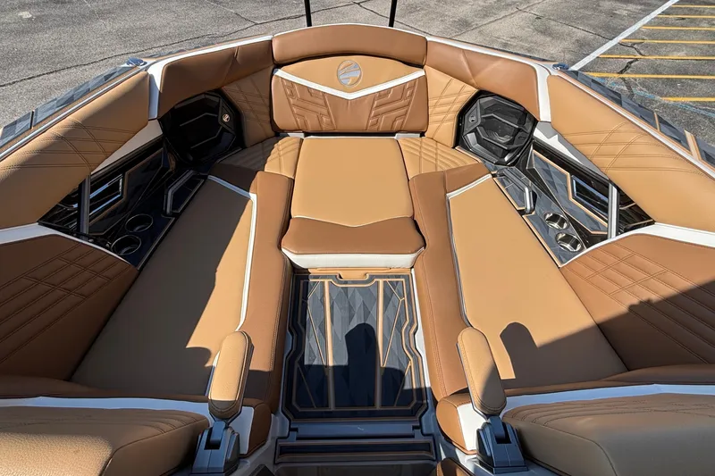 Slide: The Image of Luxurious interior of 2025 Tigé Ultré 25ZX boat with tan leather seating. - 48