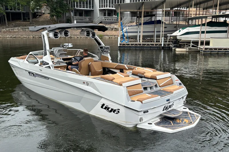 Slide: The Image of 2025 Tigé Ultré 25ZX boat rear view, showcasing sleek design and luxurious seating. - 5