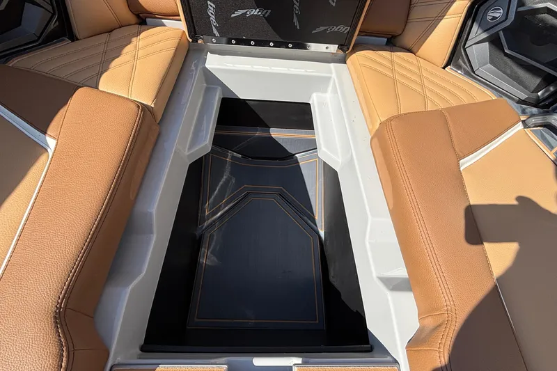 Slide: The Image of 2025 Tigé Ultré 25ZX boat interior with tan leather seating and sleek design. - 50