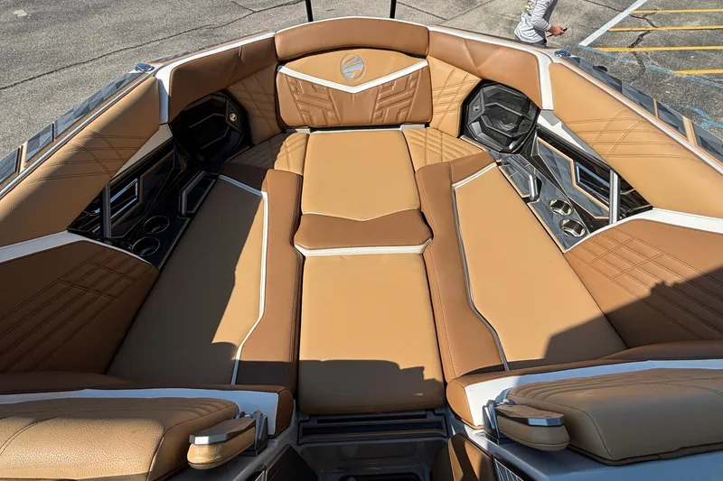 Slide: The Image of Luxurious interior of 2025 Tigé Ultré 25ZX boat with tan leather seating. - 51