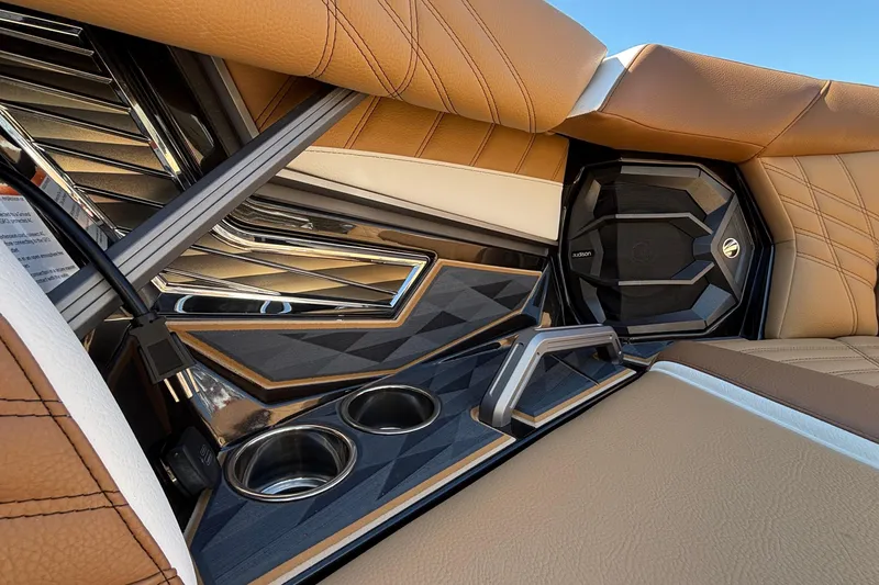 Slide: The Image of Luxurious interior of 2025 Tigé Ultré 25ZX boat with premium seating and cup holders. - 52