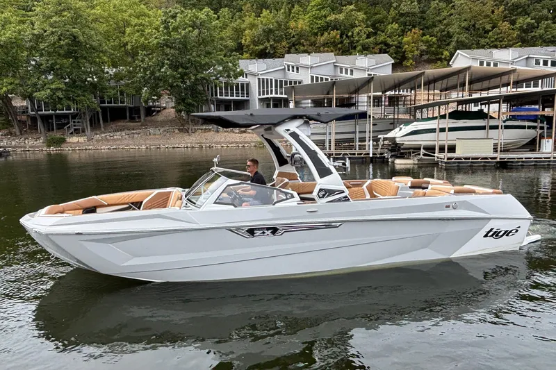 Slide: The Image of 2025 Tigé Ultré 25ZX boat underside with propeller and exhaust system. - 7