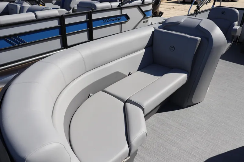 Slide: The Image of 2025 Flagship Freedom 20 LS boat with sleek gray seating and modern design. - 2