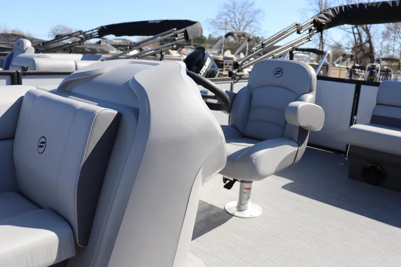 Slide: The Image of Interior of 2025 Flagship Freedom 20 LS boat with modern seating and steering wheel. - 4
