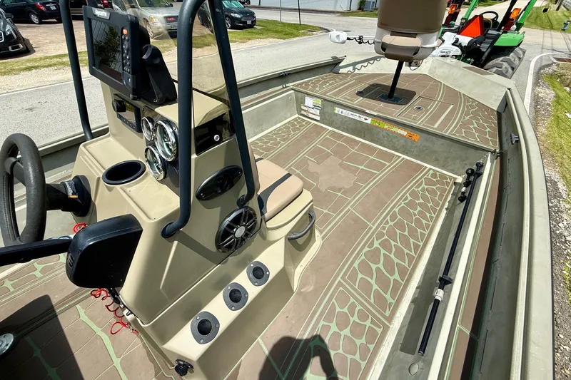 Slide: The Image of 2021 Alumacraft 2072 All Weld MV CC boat interior with console and seating. - 13