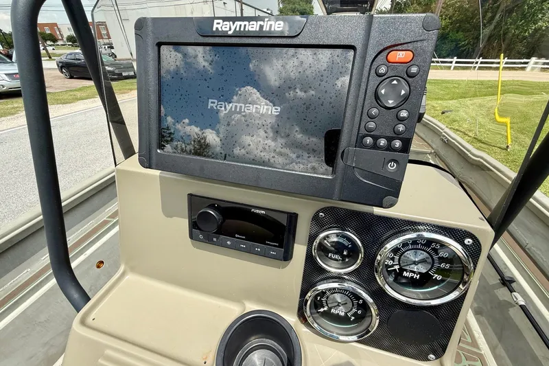 Slide: The Image of 2021 Alumacraft 2072 All Weld MV CC dashboard with Raymarine display and gauges. - 15