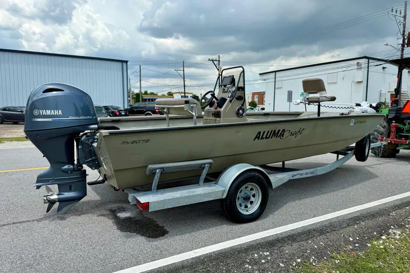 Slide: The Image of 2021 Alumacraft 2072 All Weld MV CC boat on trailer with Yamaha outboard motor. - 4