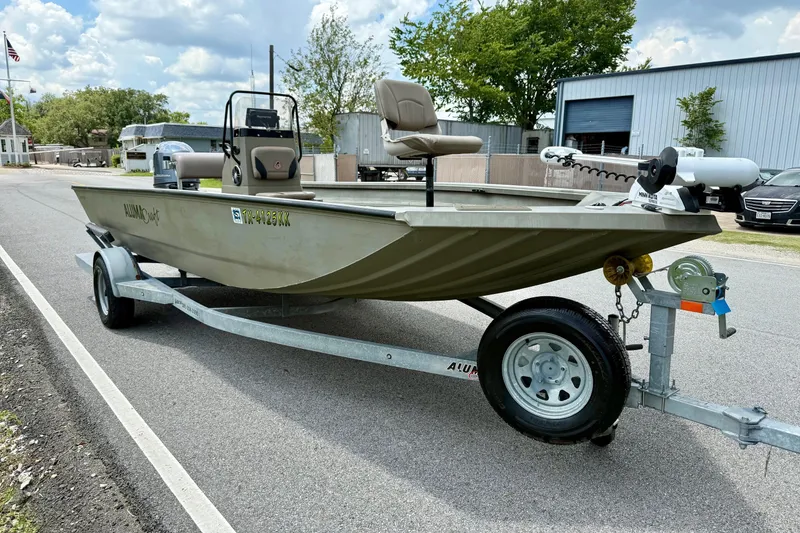 Slide: The Image of 2021 Alumacraft 2072 All Weld MV CC boat on trailer, parked outdoors. - 5