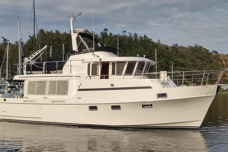 The Image of 2001 Ocean Alexander Classico yacht docked in a serene marina setting. - 0
