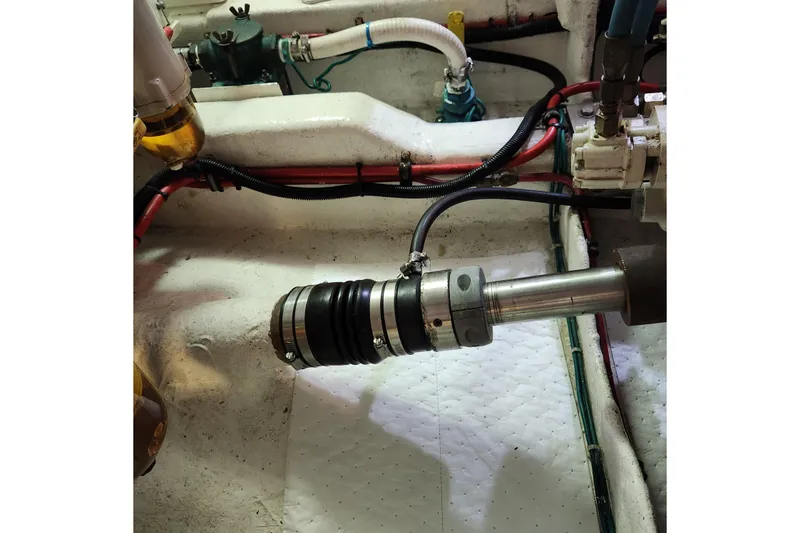 Slide: The Image of Engine room of 2001 Ocean Alexander Classico yacht, showing mechanical components and wiring. - 101