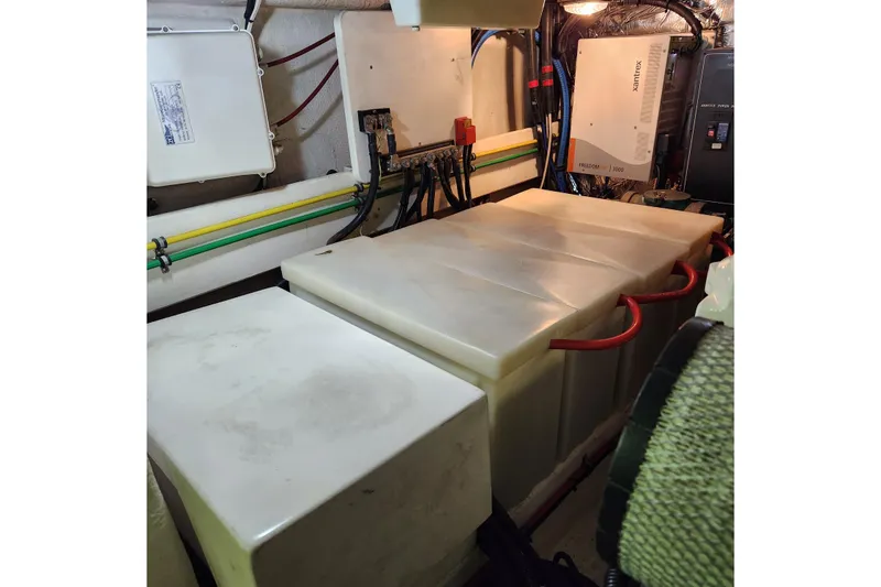 Slide: The Image of Engine room of 2001 Ocean Alexander Classico yacht with electrical systems and storage tanks. - 102