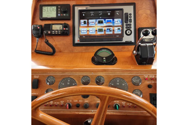 Slide: The Image of 2001 Ocean Alexander Classico helm with navigation controls and display screen. - 105