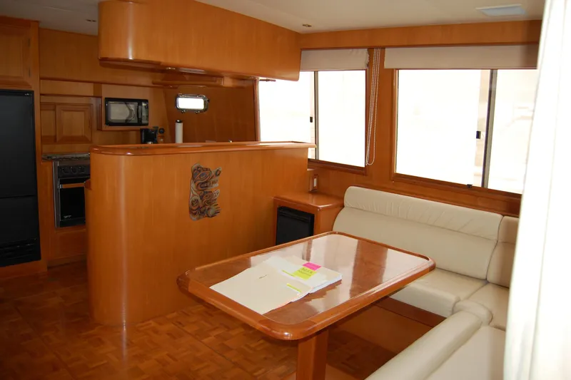 Slide: The Image of Luxurious interior of 2001 Ocean Alexander Classico yacht with wood finish and seating area. - 19