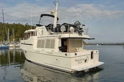 Slide: The Image of 2001 Ocean Alexander Classico yacht docked in serene marina setting. - 3