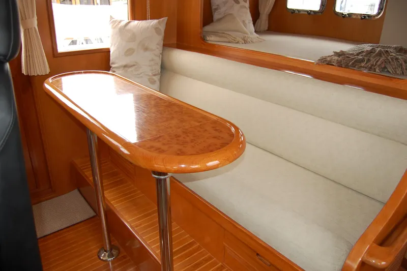 Slide: The Image of Luxurious interior of 2001 Ocean Alexander Classico yacht with elegant wood and plush seating. - 33