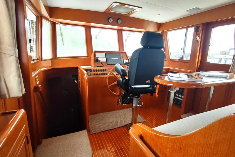 Slide: The Image of Pilothouse interior of 2001 Ocean Alexander Classico yacht with navigation equipment and seating. - 36