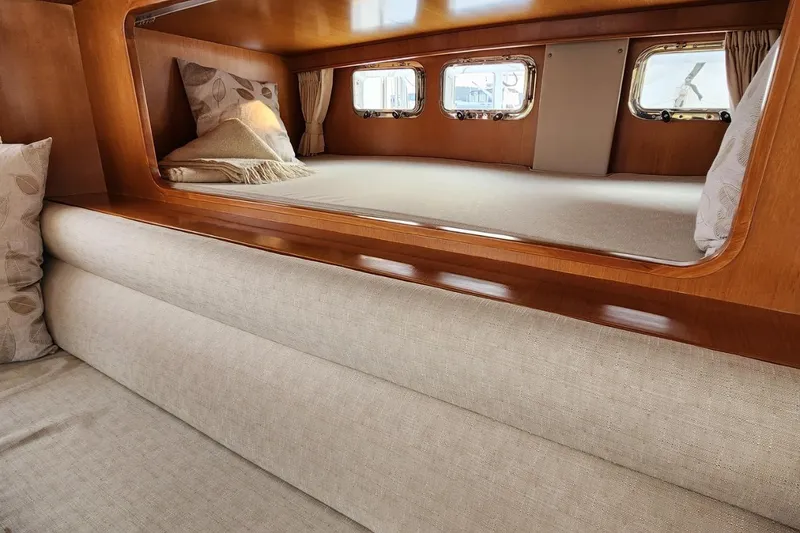 Slide: The Image of Luxurious cabin interior of 2001 Ocean Alexander Classico yacht with cozy bedding. - 43