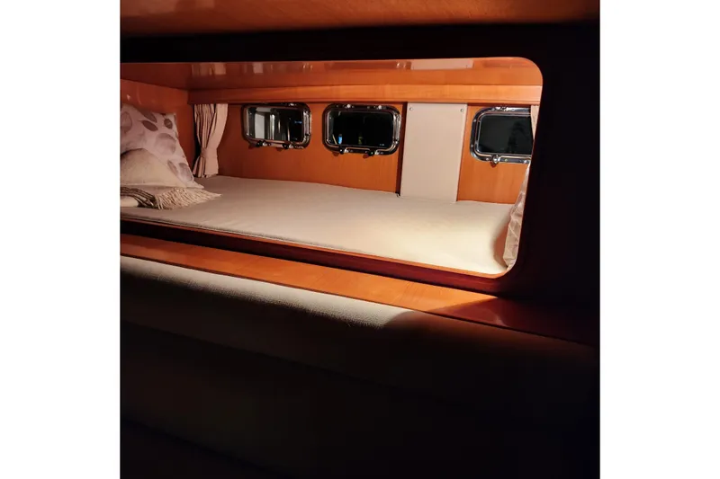 Slide: The Image of Cozy cabin interior of 2001 Ocean Alexander Classico yacht with porthole windows. - 45