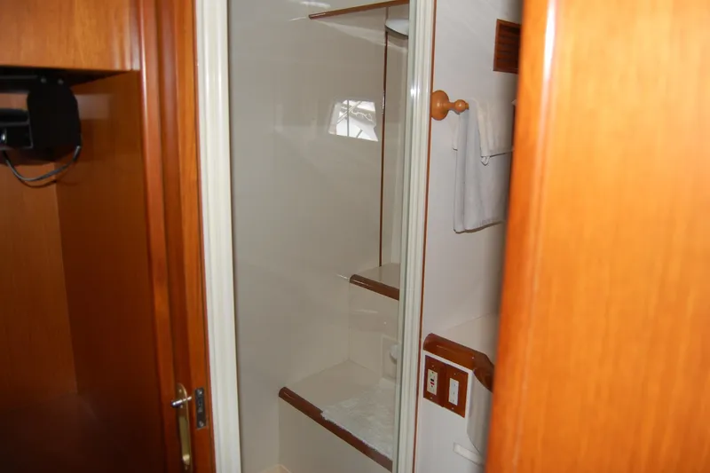 Slide: The Image of Interior of 2001 Ocean Alexander Classico yacht bathroom with wooden accents. - 53