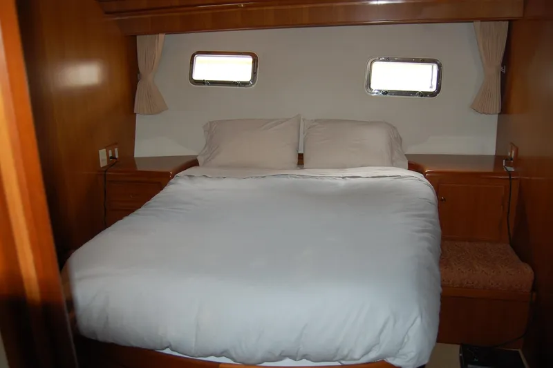 Slide: The Image of Luxurious bedroom interior of 2001 Ocean Alexander Classico yacht with cozy bedding. - 54