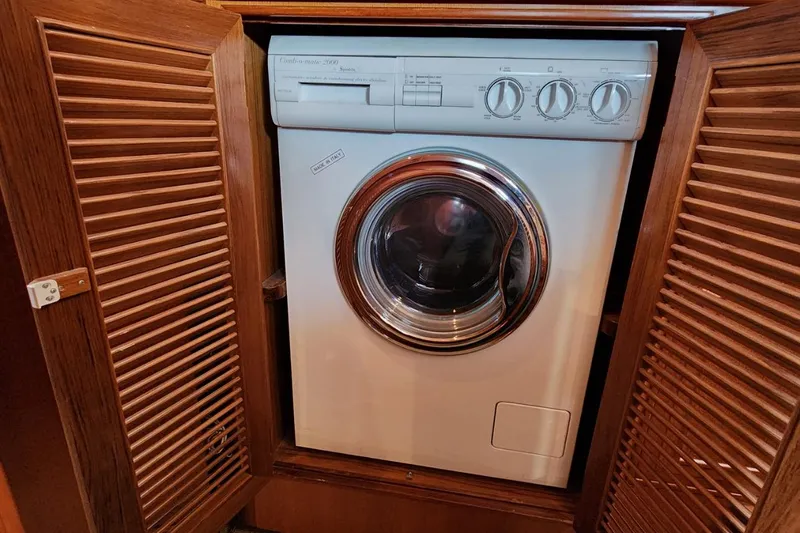 Slide: The Image of Washing machine inside wooden cabinet on 2001 Ocean Alexander Classico yacht. - 57
