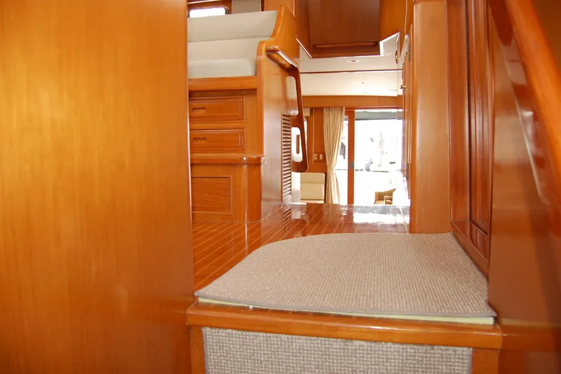 Slide: The Image of Interior of 2001 Ocean Alexander Classico yacht with polished wood and carpeted steps. - 59