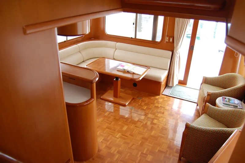 Slide: The Image of Luxurious 2001 Ocean Alexander Classico yacht interior with elegant wood finish and comfortable seating. - 60