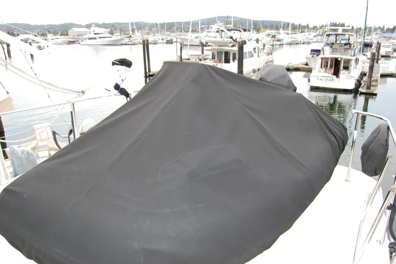 Slide: The Image of Covered deck of 2001 Ocean Alexander Classico yacht in a marina setting. - 67
