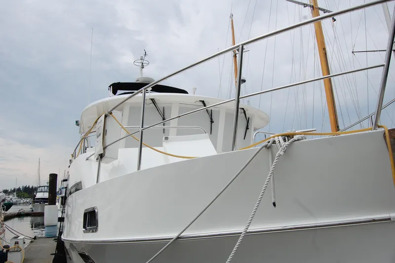 Slide: The Image of 2001 Ocean Alexander Classico yacht docked at marina, showcasing sleek design and sturdy build. - 7