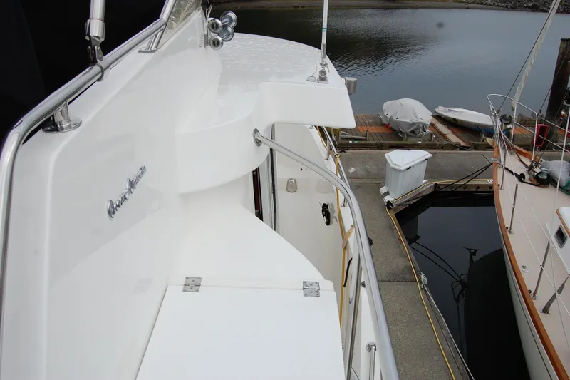 Slide: The Image of 2001 Ocean Alexander Classico yacht deck with marina view. - 70