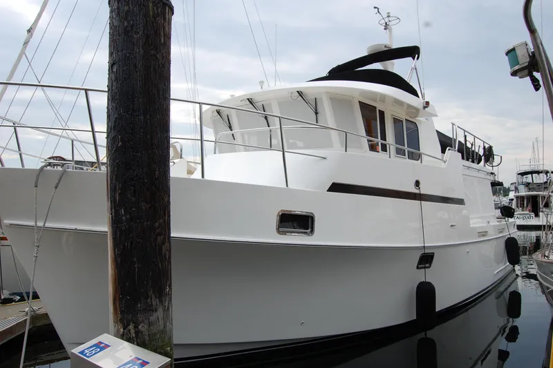 Slide: The Image of 2001 Ocean Alexander Classico yacht docked at marina, side view. - 8