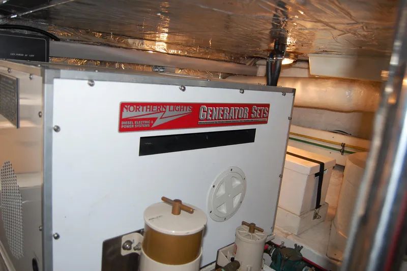 Slide: The Image of Engine room of 2001 Ocean Alexander Classico with Northern Lights generator. - 80