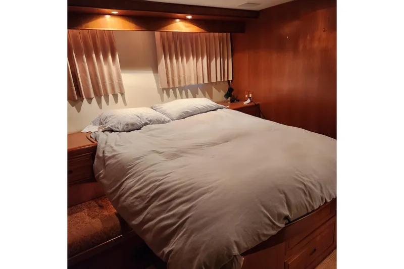 Slide: The Image of Luxurious bedroom interior of 2001 Ocean Alexander Classico yacht with cozy bedding. - 88