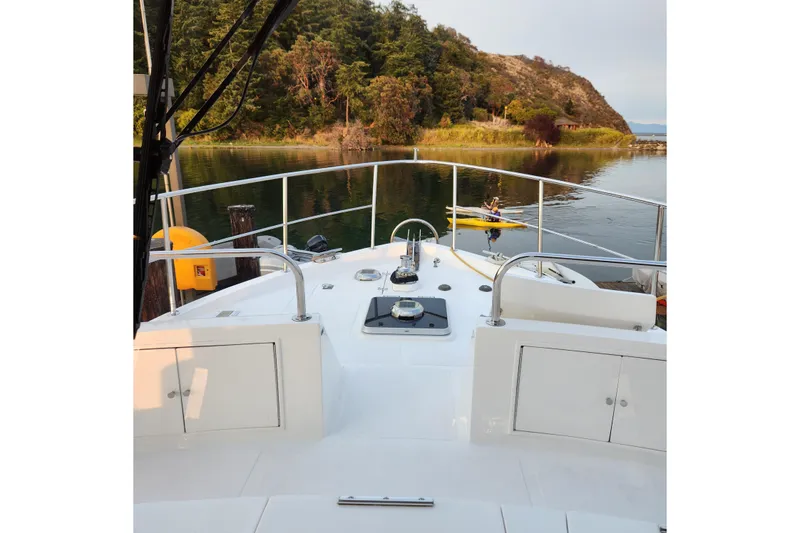 Slide: The Image of Ocean Alexander Classico 2001 yacht deck with scenic waterfront view. - 90