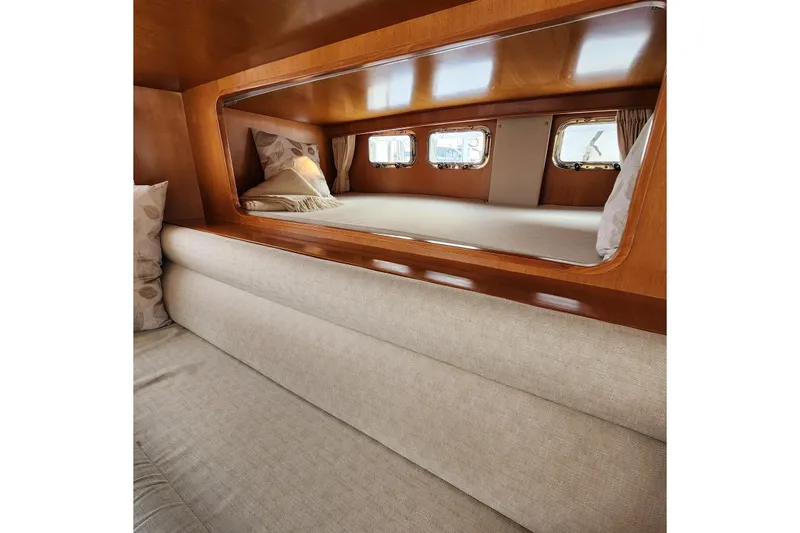 Slide: The Image of Luxurious cabin interior of 2001 Ocean Alexander Classico yacht with elegant wood finish. - 91