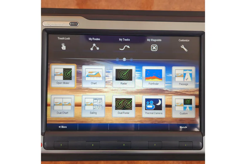 Slide: The Image of Touchscreen navigation system on 2001 Ocean Alexander Classico yacht, displaying various marine applications. - 97