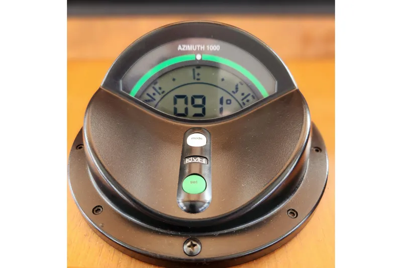 Slide: The Image of Azimuth 1000 compass on 2001 Ocean Alexander Classico yacht dashboard. - 99