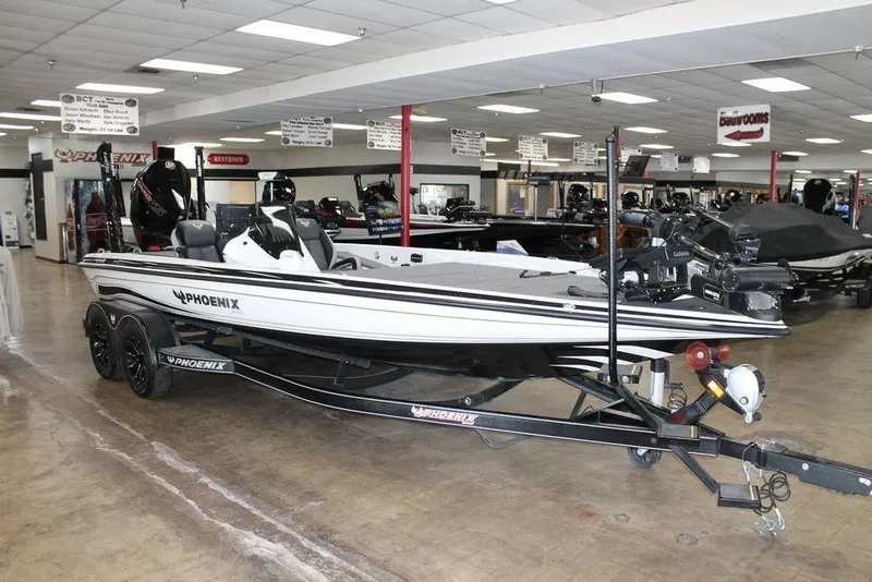 Slide: The Image of 2024 Phoenix 921 Elite II boat displayed in showroom, featuring sleek design and advanced equipment. - 4