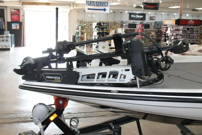 Slide: The Image of 2024 Phoenix 921 Elite II boat with Minn Kota Ultrex trolling motor in showroom. - 5
