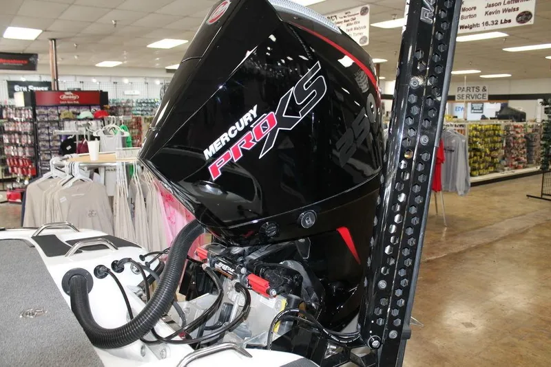 Slide: The Image of 2024 Phoenix 921 Elite II with Mercury Pro XS engine in showroom. - 7