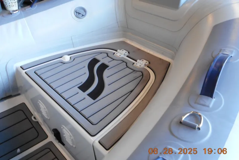 Slide: The Image of 2024 Highfield CL310 boat interior with storage compartment and handle. - 6