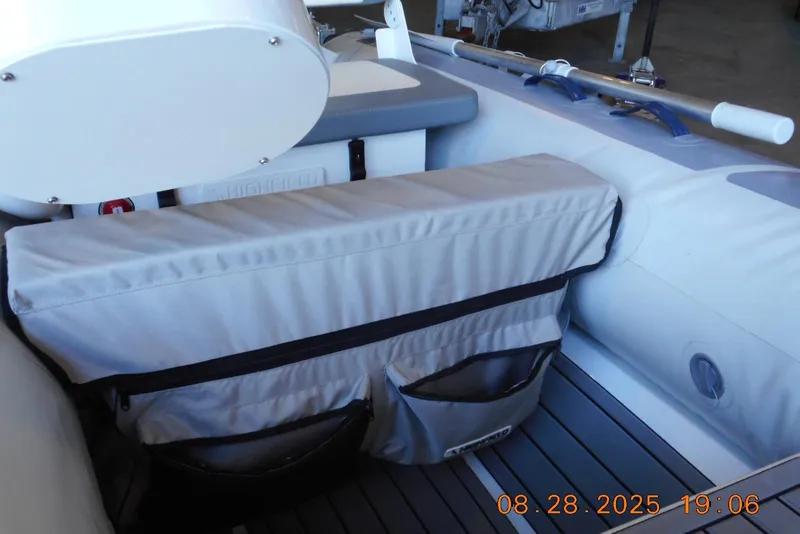 Slide: The Image of 2024 Highfield CL310 inflatable boat interior with storage compartments and seating. - 7
