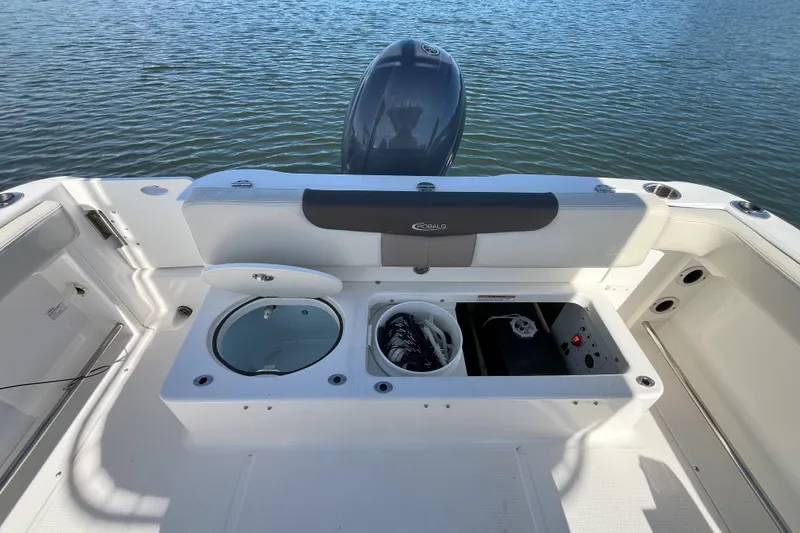 Slide: The Image of 2019 Robalo R222 Explorer boat interior with storage compartments and seating. - 5