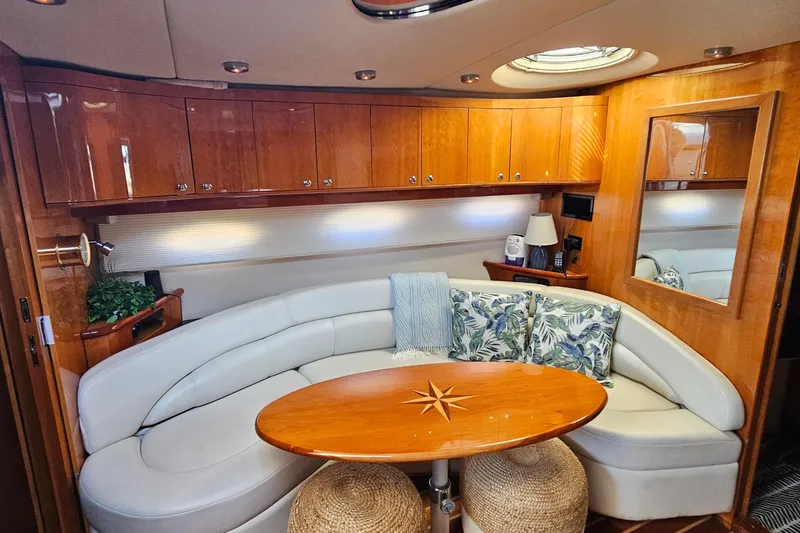 Slide: The Image of Luxurious interior of 2005 Regal Commodore 4260 yacht with elegant seating and wooden cabinetry. - 19