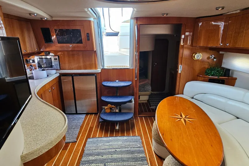 Slide: The Image of Luxurious interior of 2005 Regal Commodore 4260 yacht with wood finishes and modern amenities. - 22