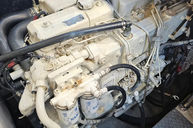 Slide: The Image of Engine of a 2005 Regal Commodore 4260 boat, showcasing intricate mechanical components. - 36