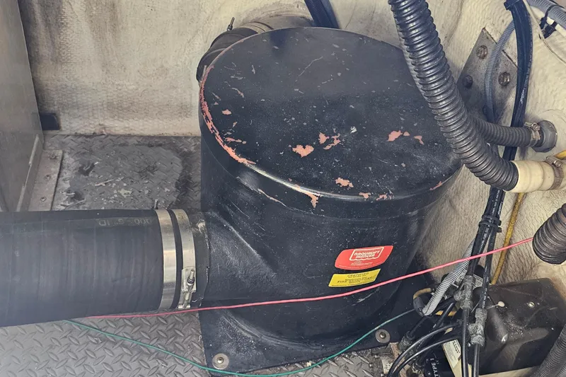 Slide: The Image of Engine compartment of a 2005 Regal Commodore 4260 with visible hoses and components. - 39