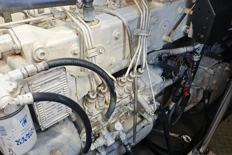 Slide: The Image of Engine components of a 2005 Regal Commodore 4260, showcasing hoses and wiring. - 40